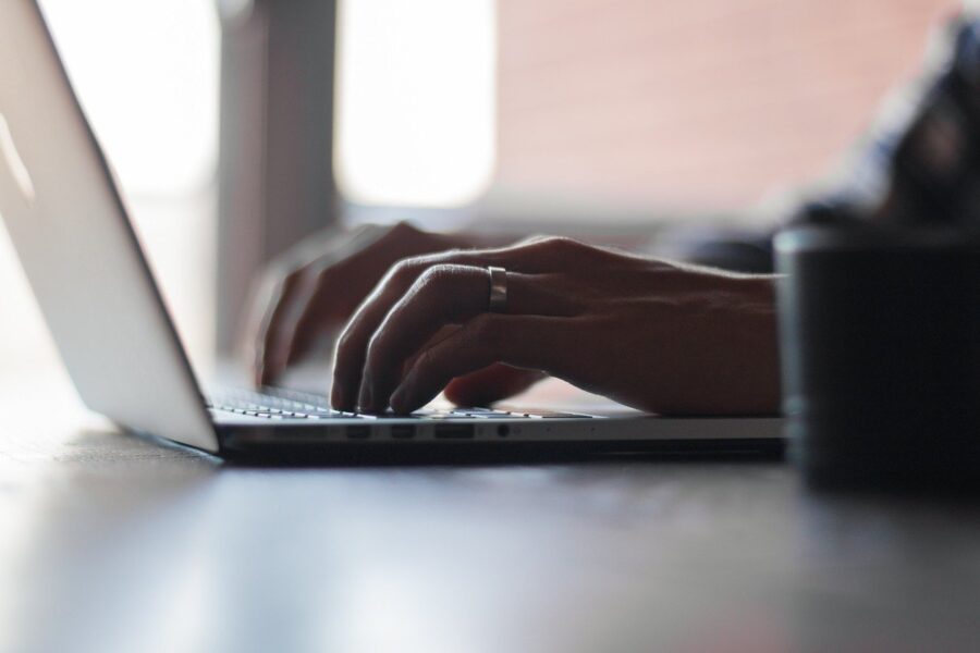 Image of a nursing home abuse attorney typing on a laptop, representing the experience of Brewer & Giggenbach, PLLC attorneys in fighting for your loved one’s rights.