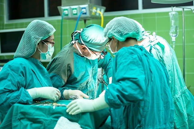 Image of doctors performing a surgical procedure, representing how a West Virginia medical malpractice attorney fights for compensation for injuries caused by health care providers.