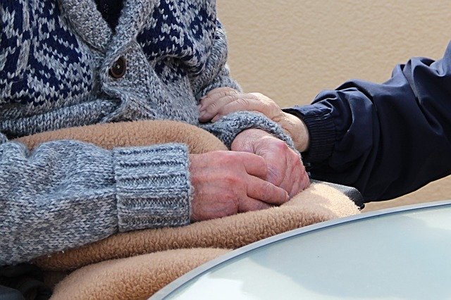 Image of a Morgantown nursing home abuse attorney comforting an elderly person in a wheelchair, representing the experience of Brewer & Giggenbach, PLLC attorneys in fighting for your loved one’s rights.